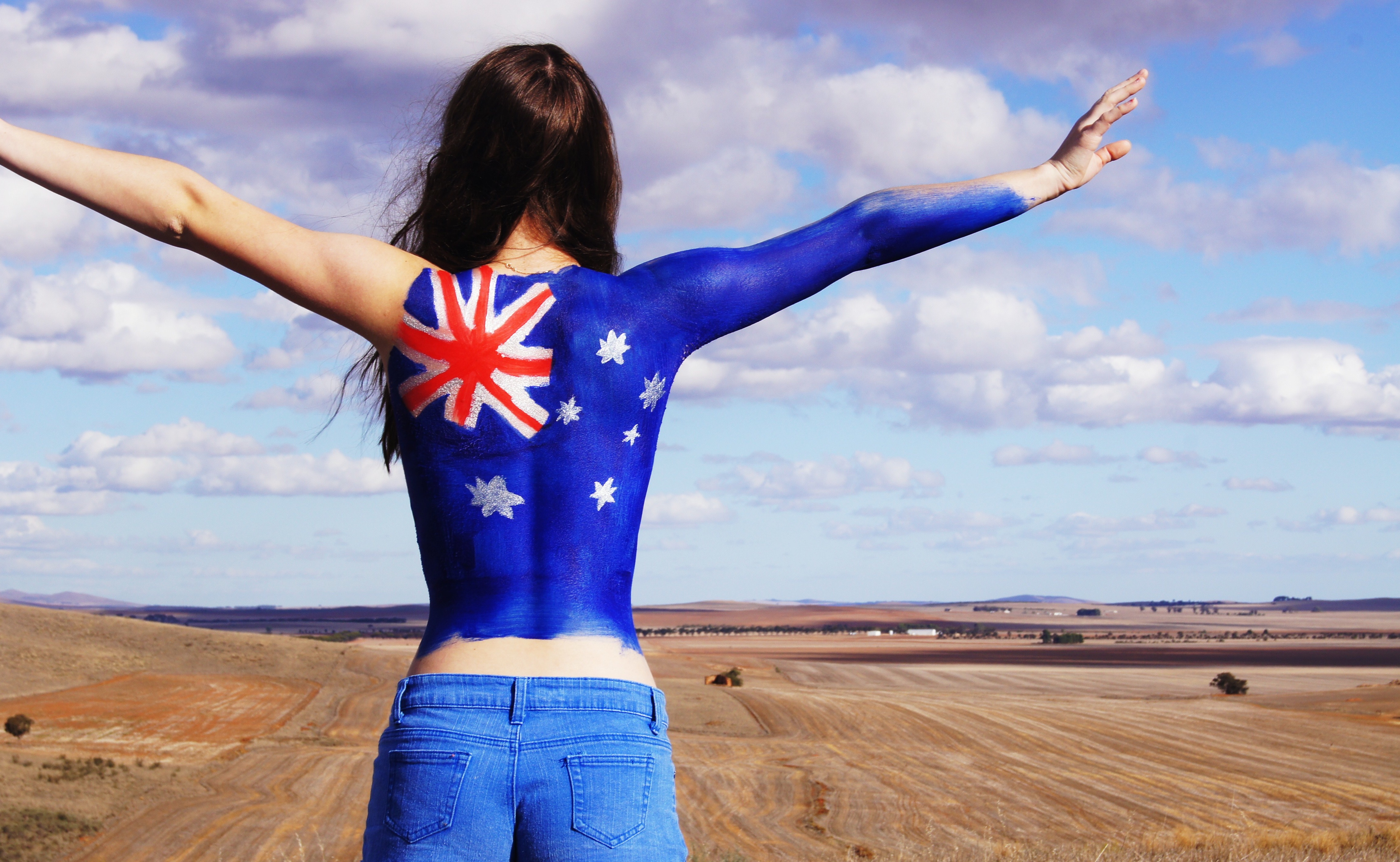 Girl with Australian flag painted on her back